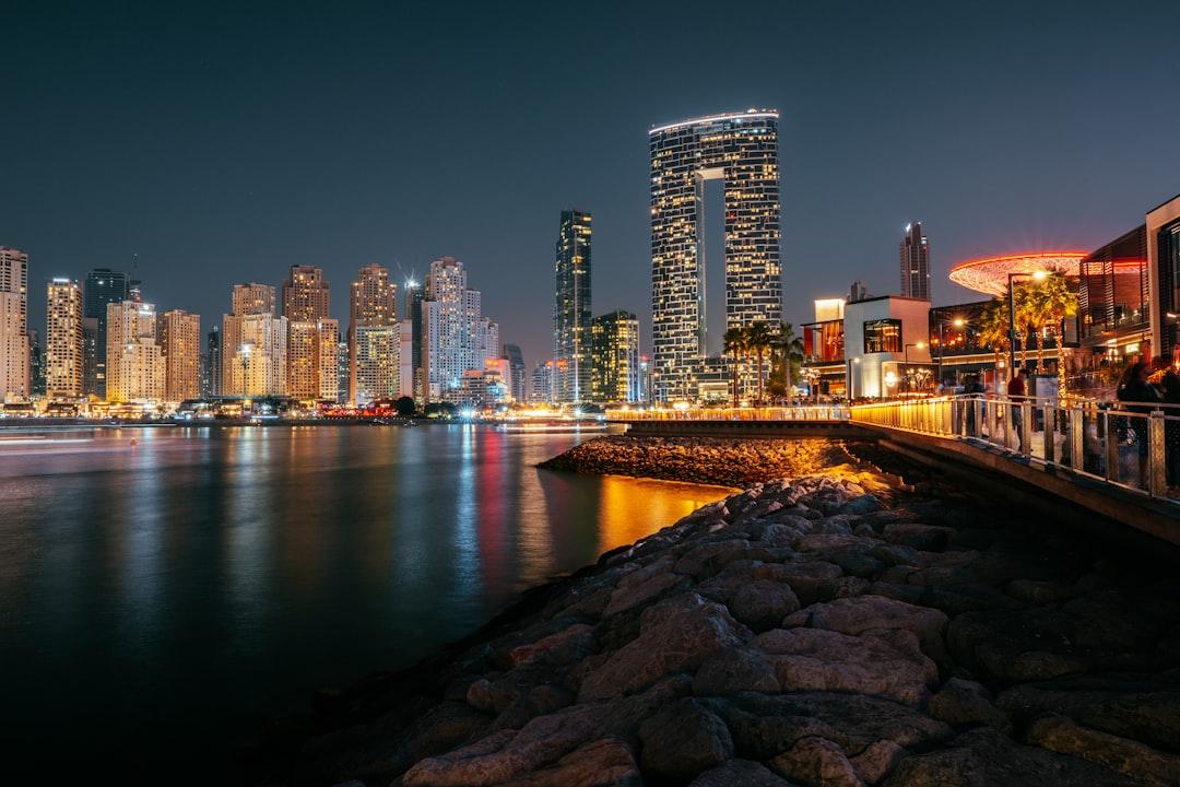 a bridge over a body of water with a city in the background — Photo by Tobias Reich on Unsplash