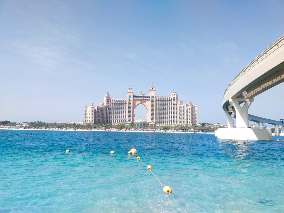 a body of water with a bridge in the background — Photo by Nitya Aggarwal on Unsplash