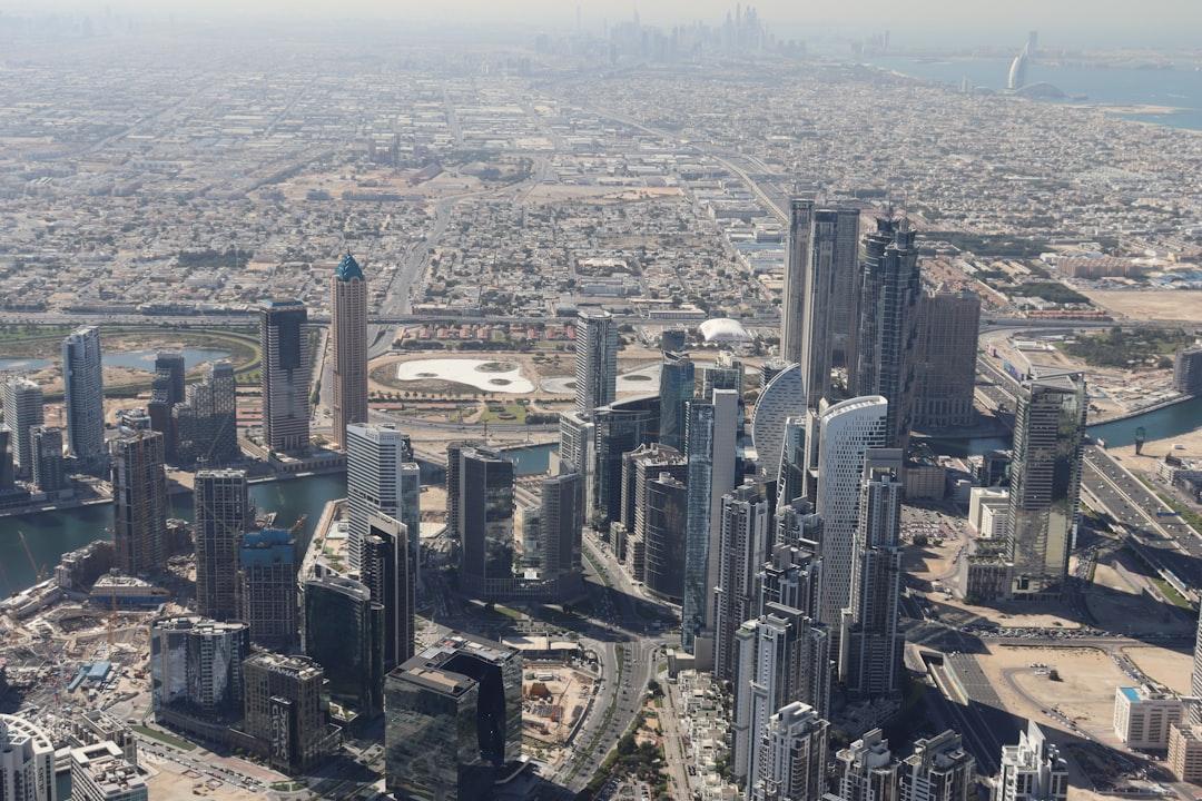 an aerial view of a city with tall buildings — Photo by Alicja Ziaj on Unsplash