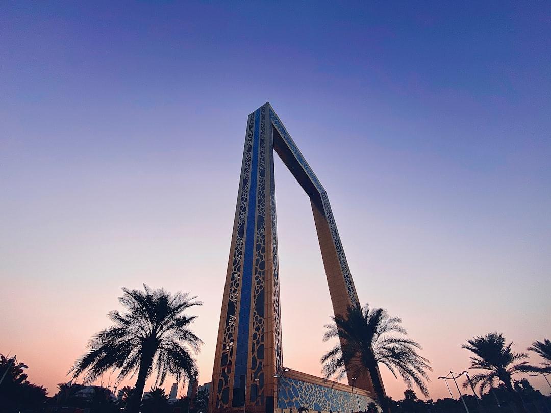 palm tree near brown building — Photo by Shreyas Gupta on Unsplash