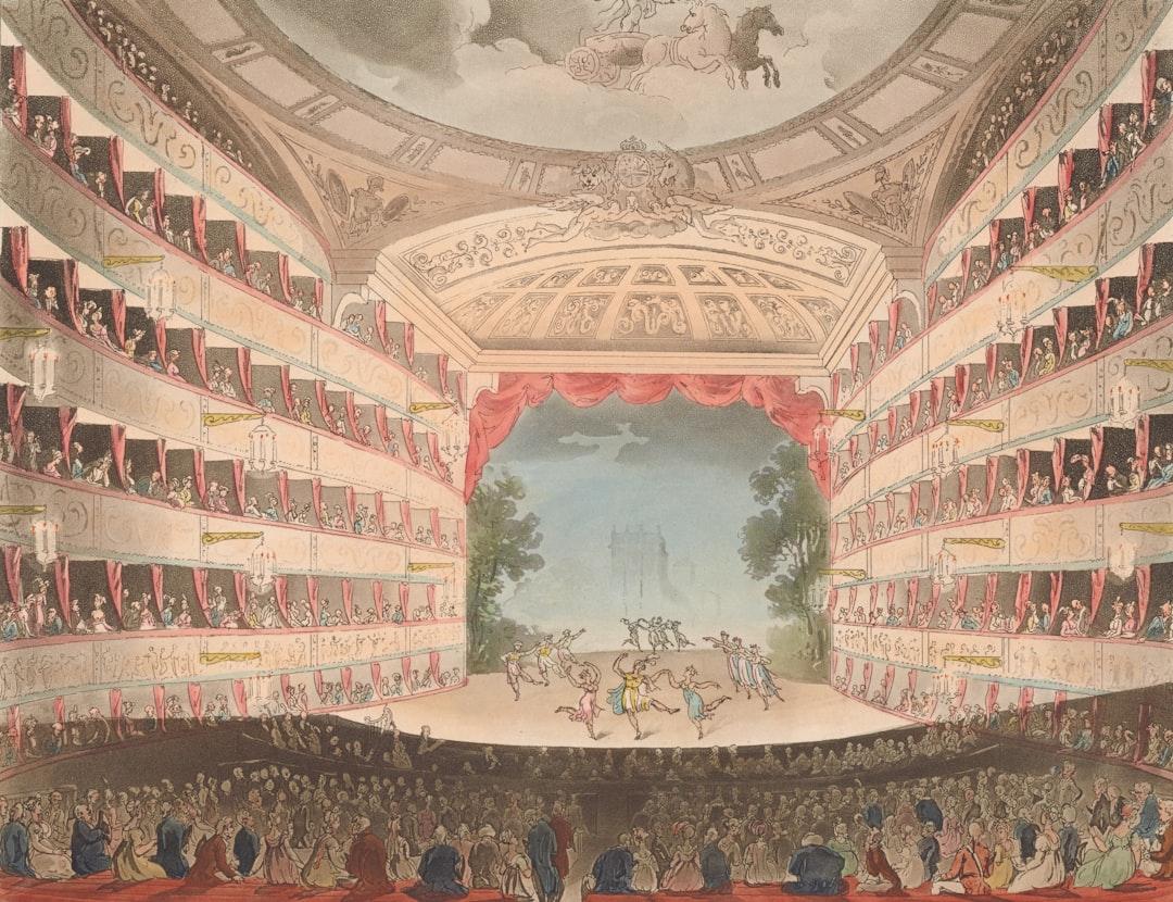 An ornate theater filled with an audience watching a performance. — Photo by The New York Public Library on Unsplash