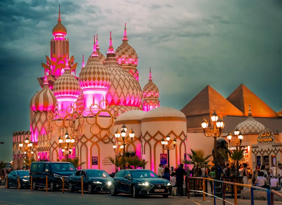 Fantasy architecture illuminated with pink lights at dusk. — Photo by Anubhav Sonker on Unsplash