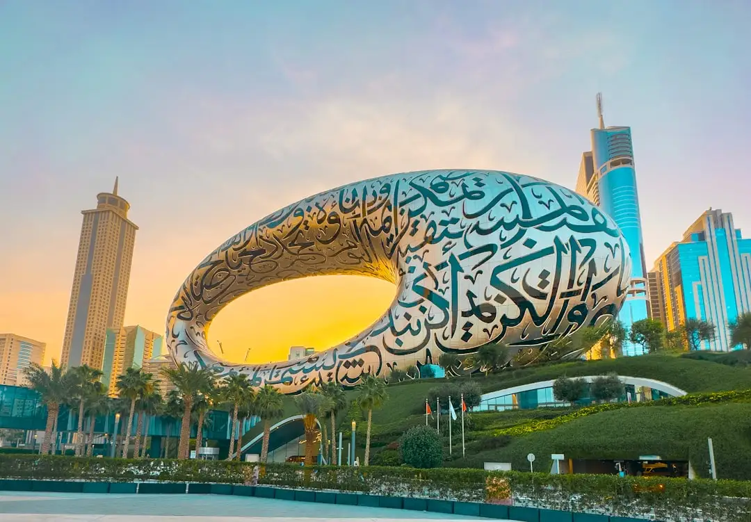 a large sculpture of a whale in front of a cityscape — Photo by Haris khan on Unsplash