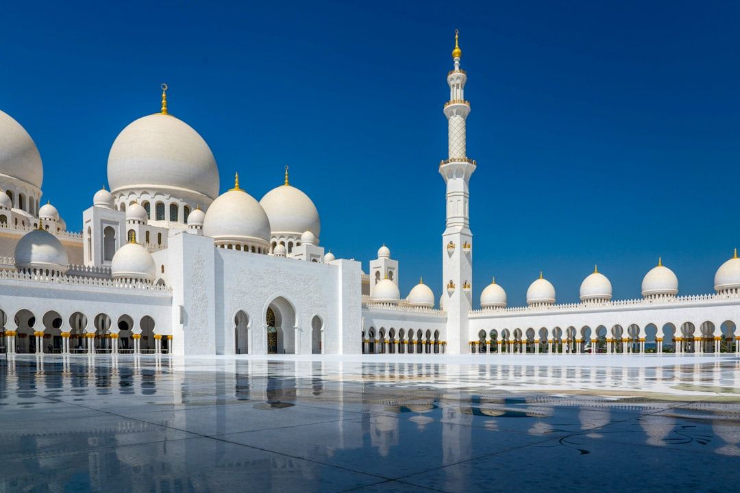 white and gold dome building under blue sky during daytime — Photo by Nick Fewings on Unsplash