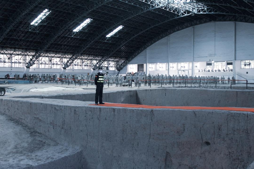 man in black jacket standing on gray concrete floor — Photo by Antonella Vilardo on Unsplash