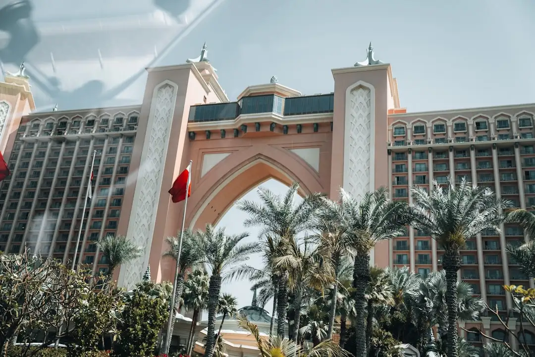 A large building with a clock tower in front of it — Photo by Nejc Soklič on Unsplash