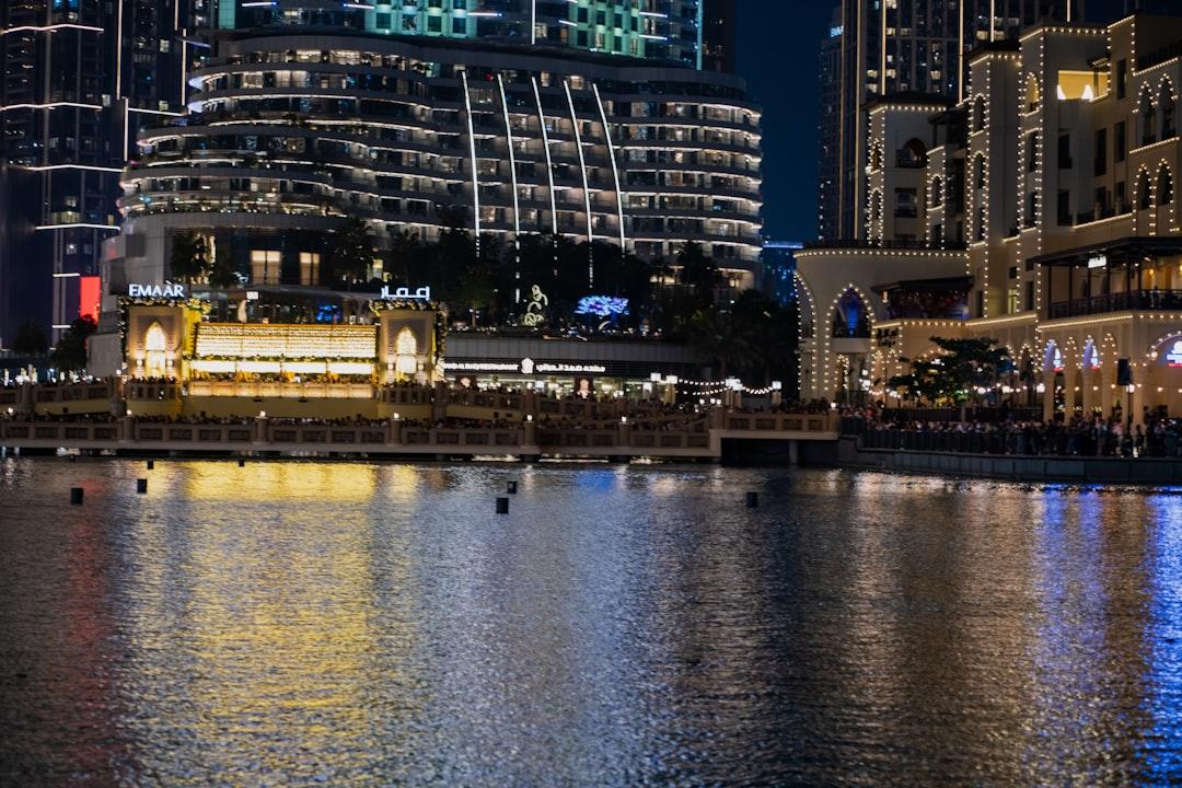 A large body of water with buildings in the background — Photo by Usman Yousaf on Unsplash