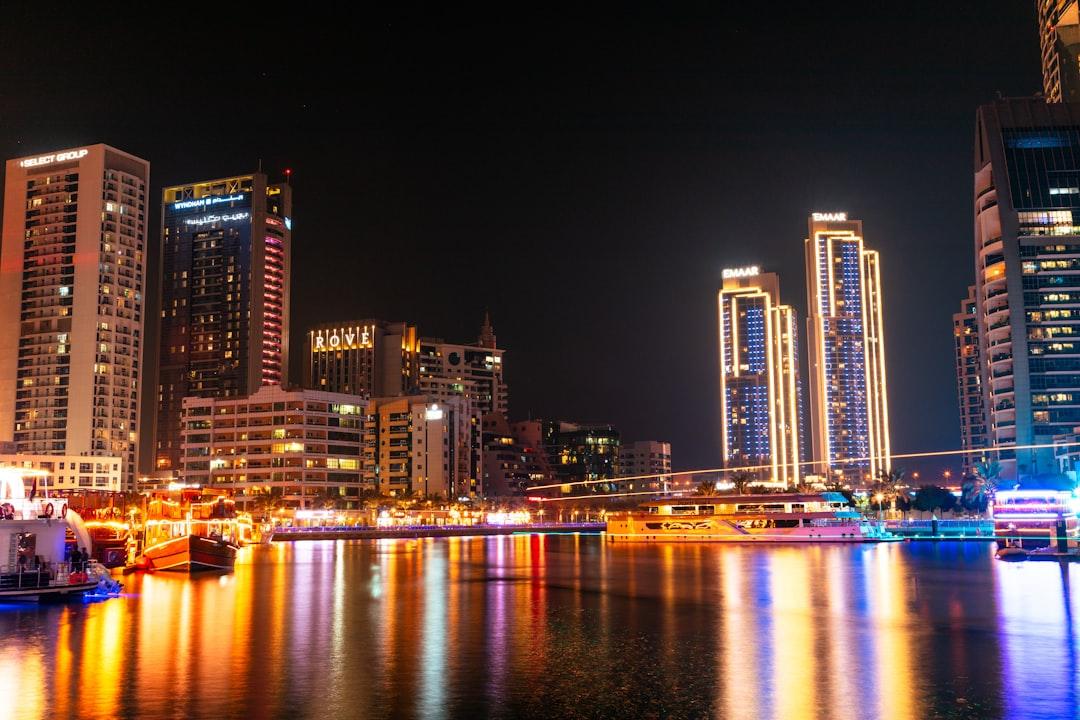 a large body of water surrounded by tall buildings — Photo by Collab Media on Unsplash