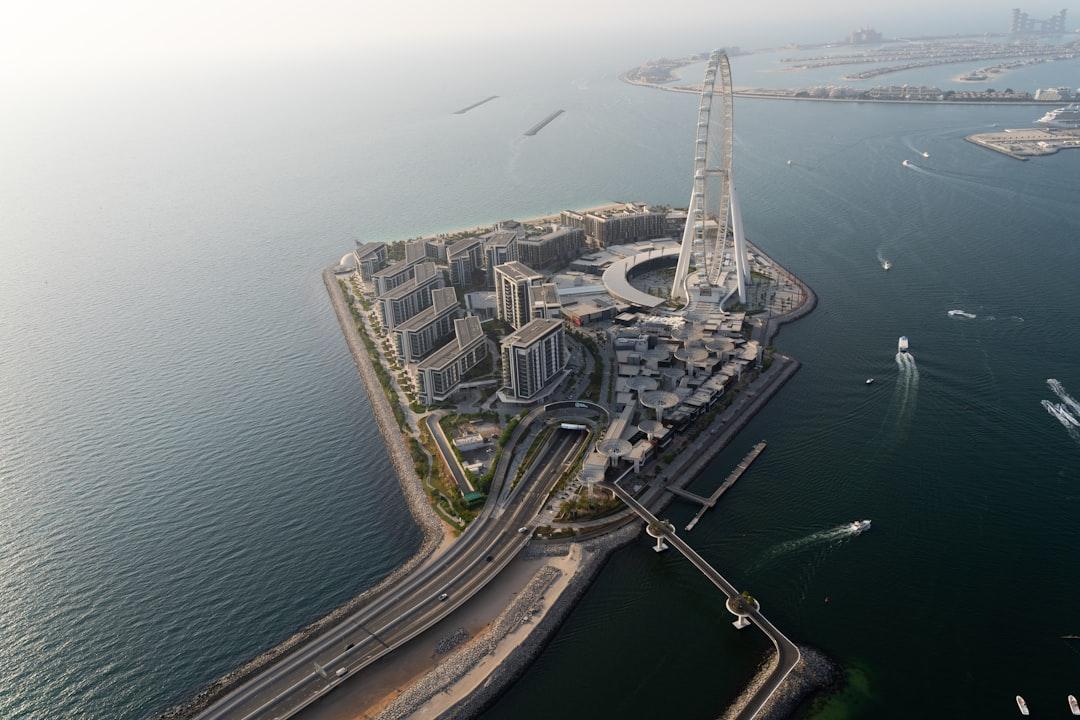 aerial view of city buildings near body of water during daytime — Photo by Joel Ambass on Unsplash