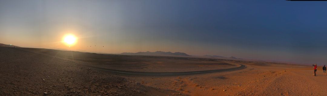 a couple of people walking across a desert — Photo by Bernd 📷 Dittrich on Unsplash