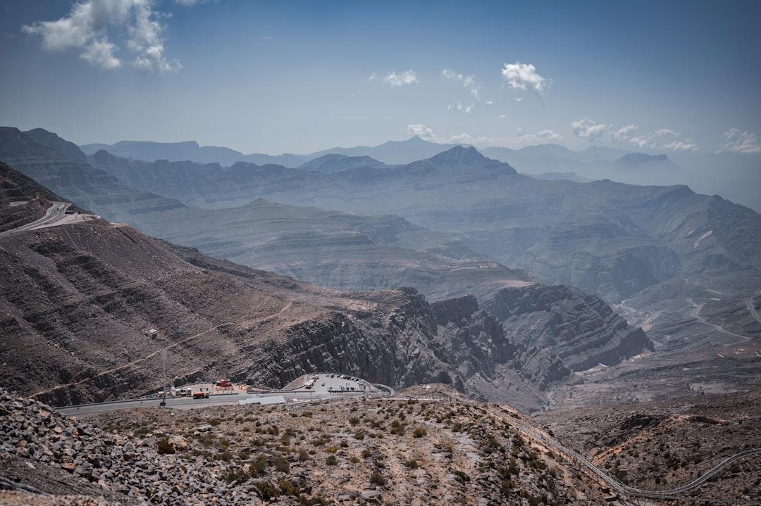 a scenic view of mountains and a road — Photo by Dilip James on Unsplash
