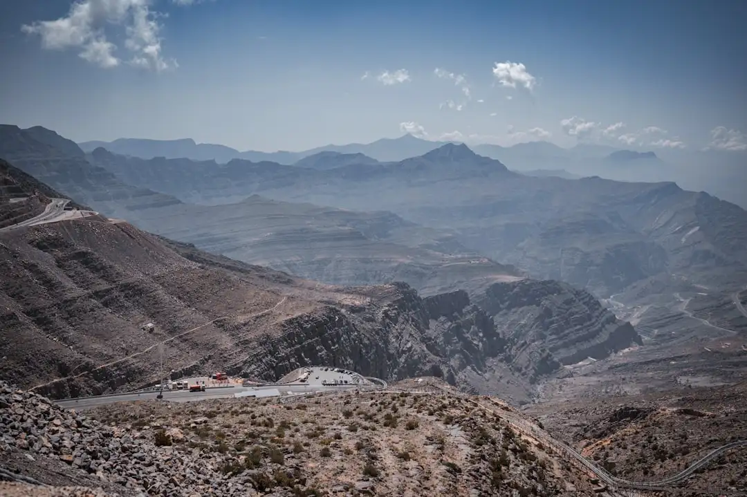 a scenic view of mountains and a road — Photo by Dilip James on Unsplash
