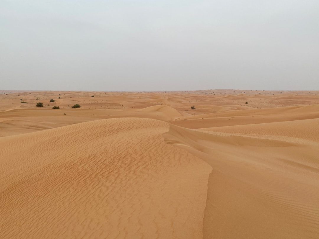 brown sand under blue sky during daytime — Photo by Datingscout on Unsplash