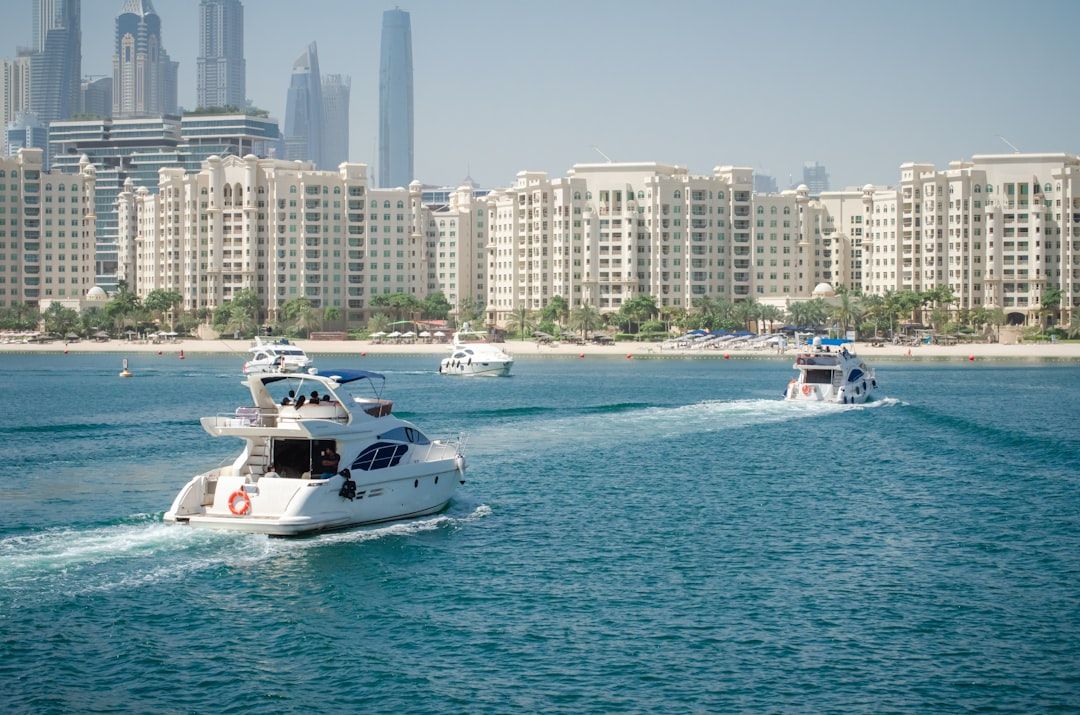 a group of boats in the water near a city — Photo by Youssef on Unsplash