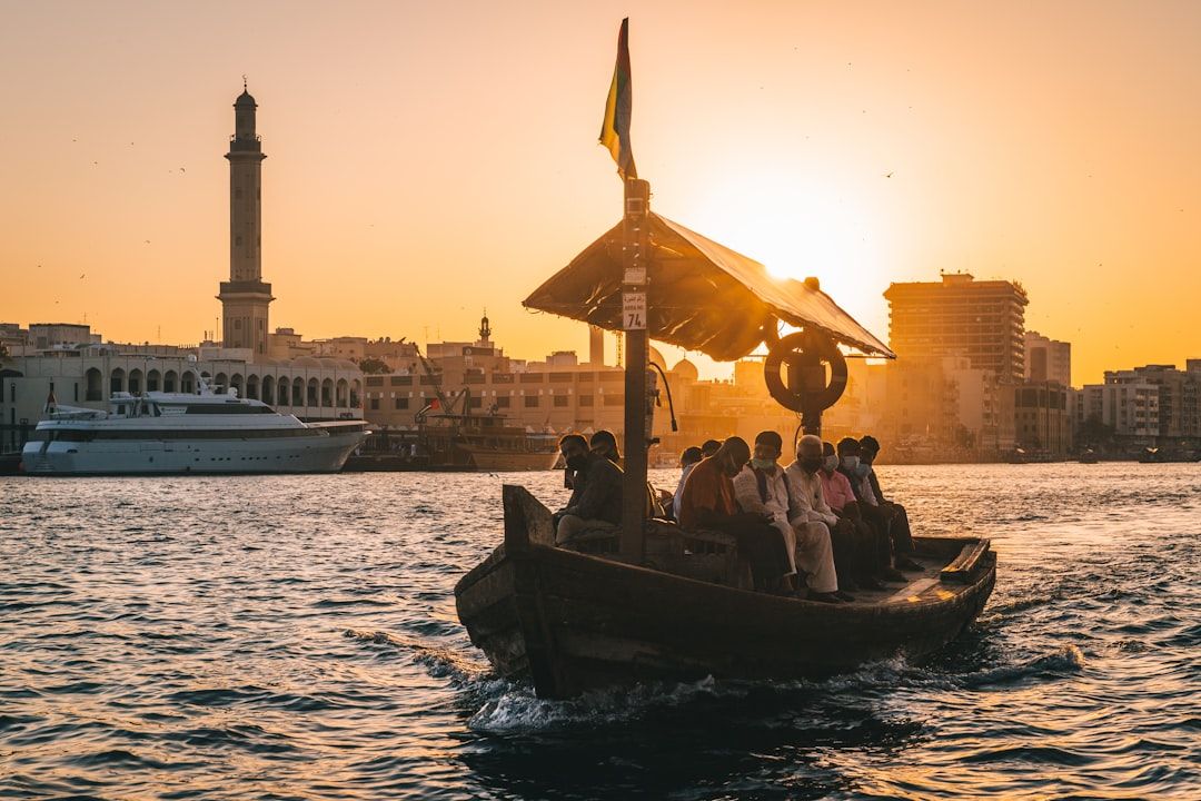 a group of people riding on the back of a boat — Photo by Nicolas Jehly on Unsplash