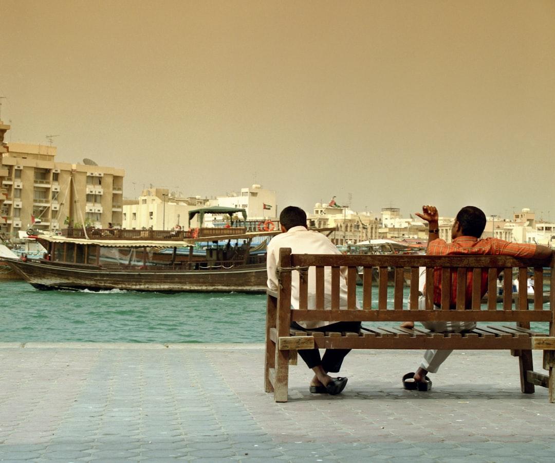 a couple sitting on a bench — Photo by Larry Costales on Unsplash