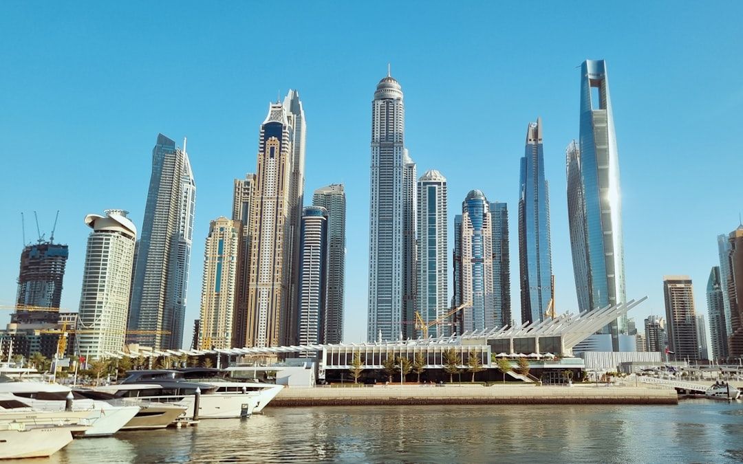 A large body of water surrounded by tall buildings — Photo by Rushikesh Patil on Unsplash