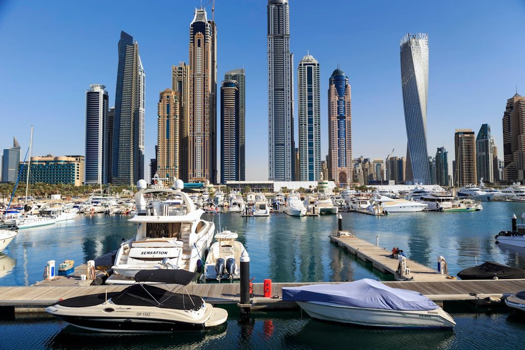 Boats and skyscrapers line a beautiful harbor. — Photo by martin bennie on Unsplash